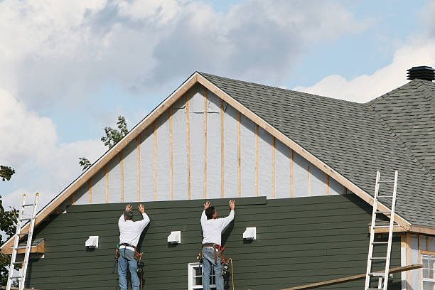 Professional Storm Damage Siding Repair technician working in Vermillion, MN